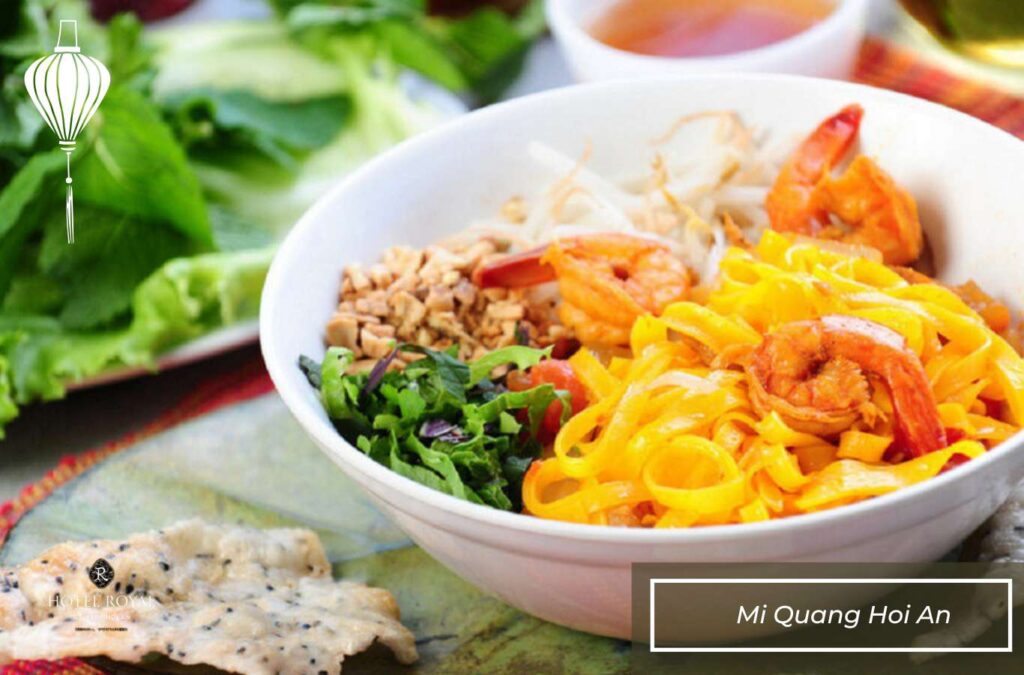 Mi Quang’s broth, simmered from pork bones and shrimp, gives the dish its rich flavor.